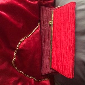 Red and burgundy clutch bag